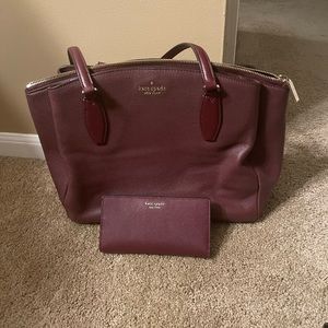 A burgundy Kate Spade tote.